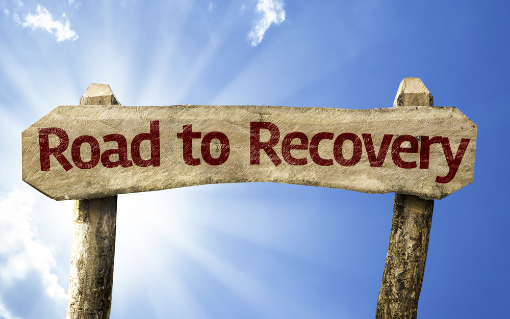 A sign saying road to recovery