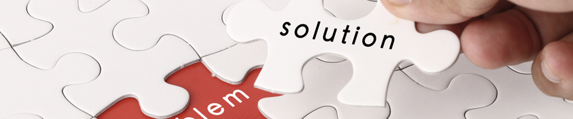 A jigsaw puzzle pice saying solution