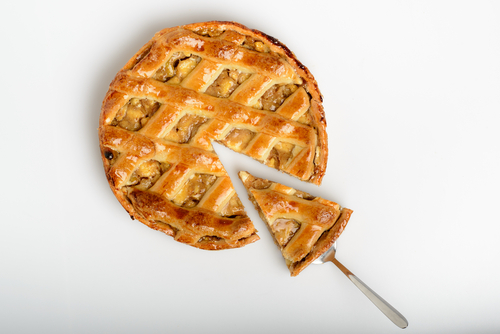 A pie with a slice being removed from it