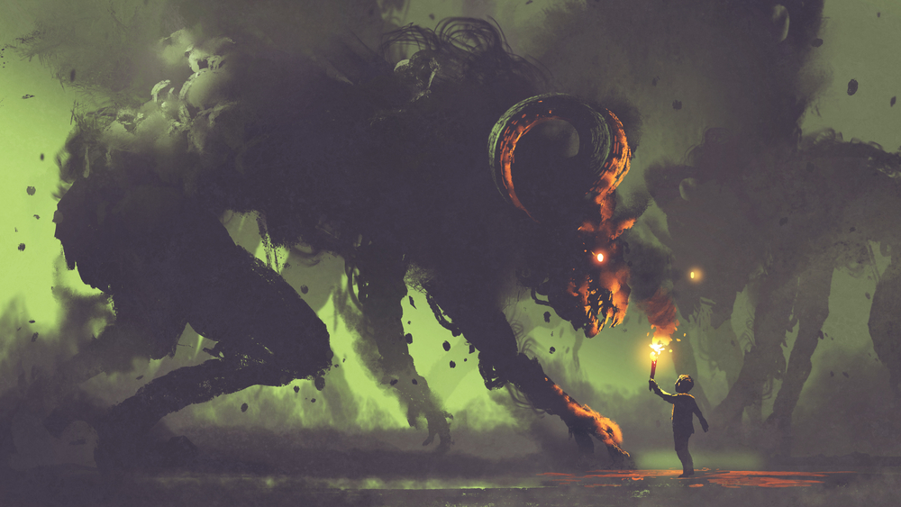 A man facing up to a monster